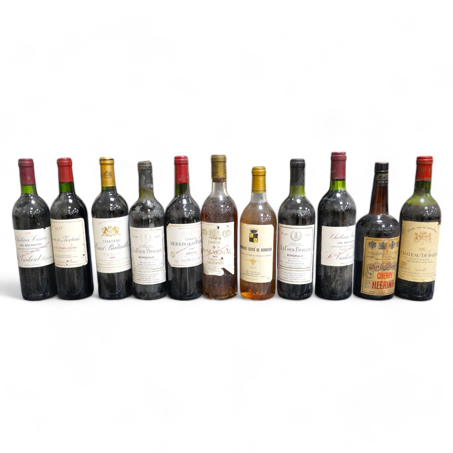 Eleven bottles of wine: Chateau Moulin Hargue 2003 x1, Chateaux Cissac 1982x2, Chateau la Coer Pavillion 1981 x2, Chateaux de barbe 1976 x1, Chateaux Haut Batailly 1998 x1, Premier Cotes de Bordeaux NV x1, Domain de Mart